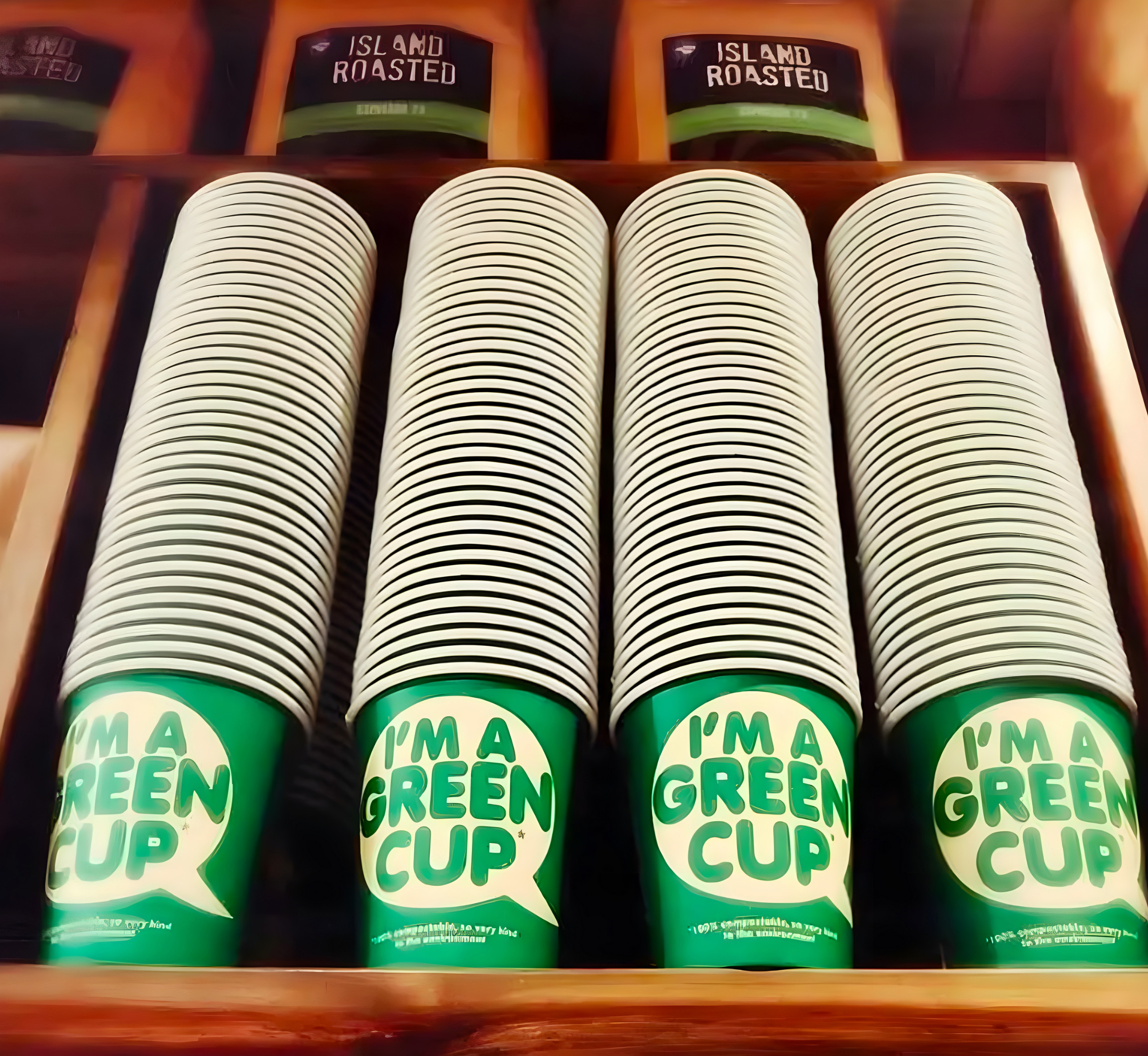 Stacks of green eco paper cups.